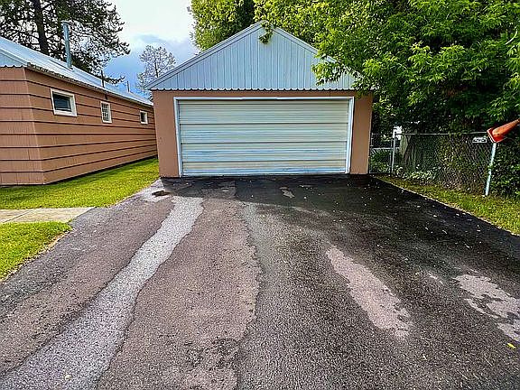 Garage & Paved Driveway