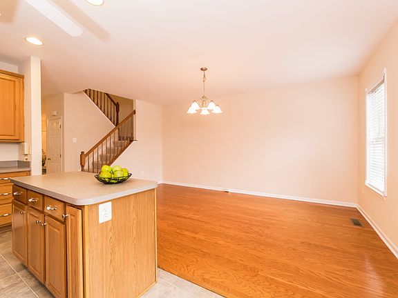 Large dining area with hardwood floors