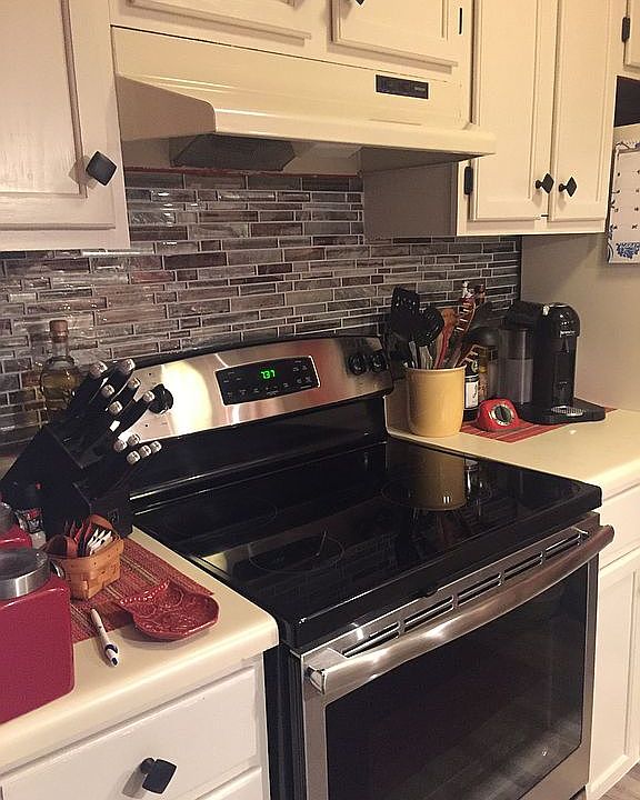 New stove w/ tile backsplash
