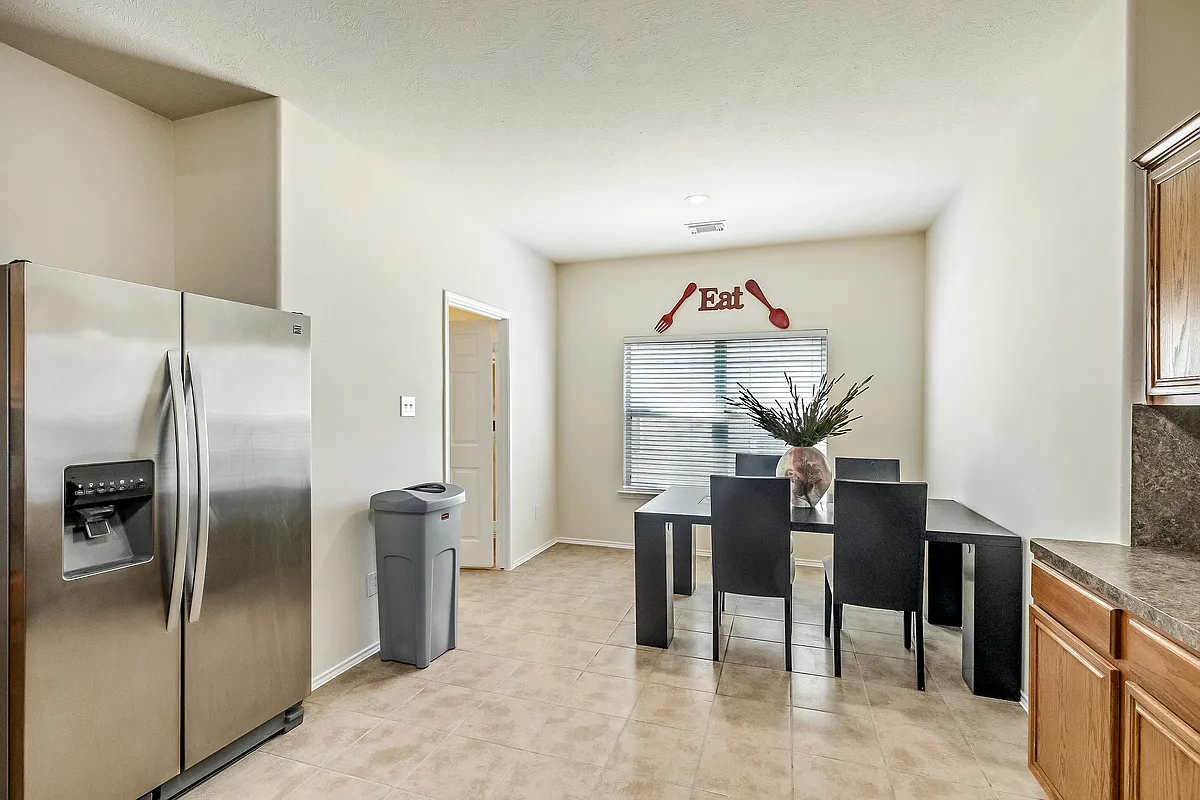 Enjoy some grub in this gorgeous and spacious open concept kitchen with gas stove and stainless steel refrigerator! - Clarendon Bend Ln