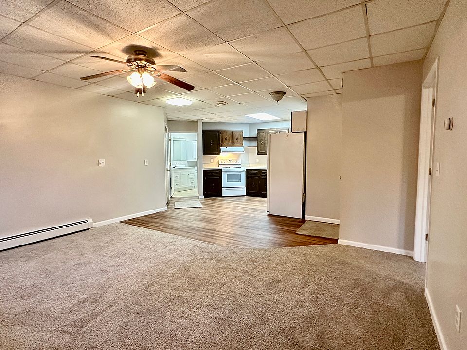 Living room space leading to kitchen