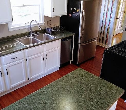 Bright and clean kitchen with stainless steel appliances with ample counter space