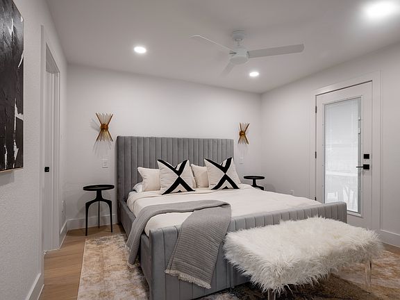 Master Bedroom - King with Tuft and Needle Mattress. Door to outside patio area