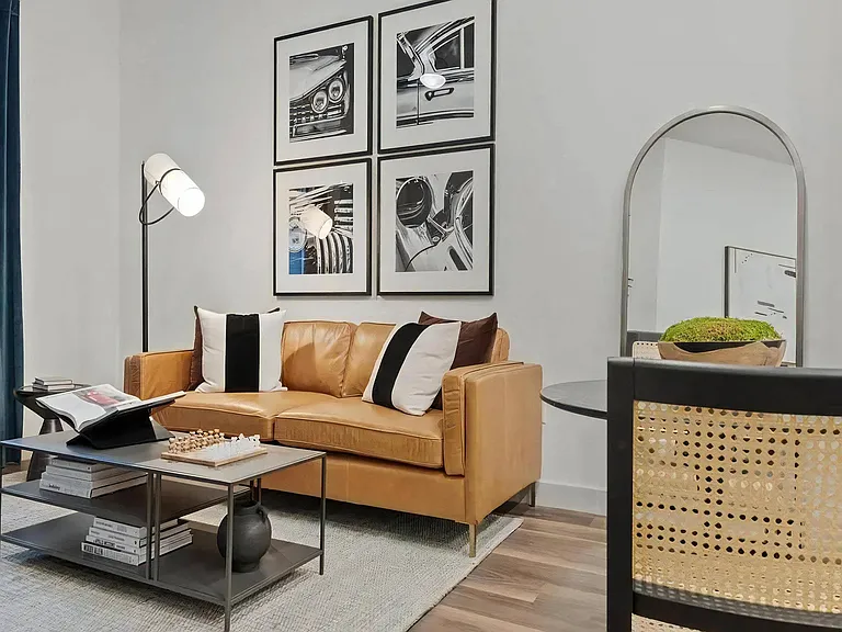 Shared Living and Dining Space with Artwork and Lounge Seating
