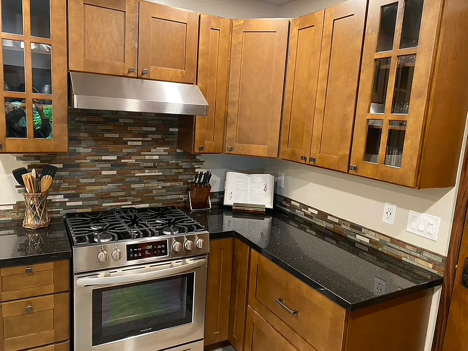 Kitchen cabinetry, stove, granite counter tops