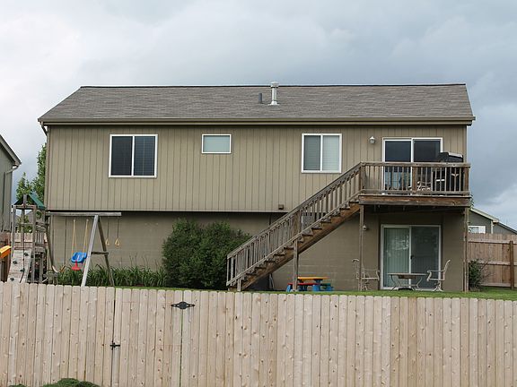 Deck, landscaping, swing set