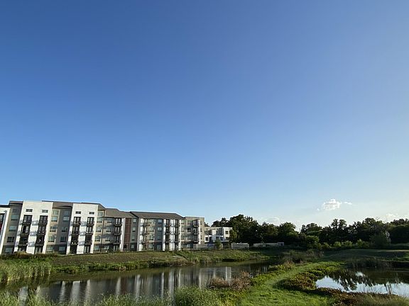 Serene Views: Bedrooms overlook a tranquil small pond.