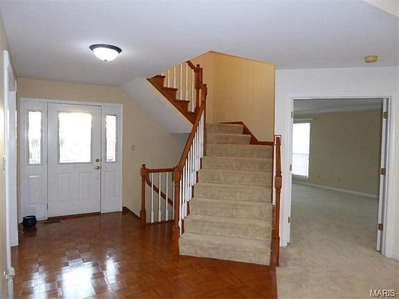 Entry Foyer Greets your guest with Open Stairs to the upper and Lower Level Yes that's a Main Floor Luxury Master Suite!