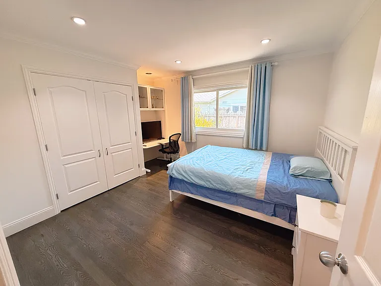 Second bedroom with costom built-in shelf closet