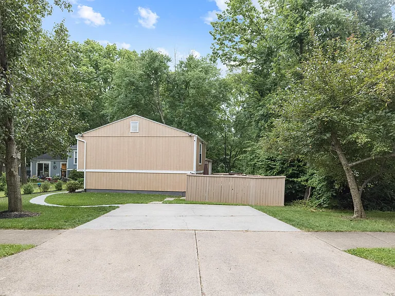 2 car driveway with access to front door and back patio