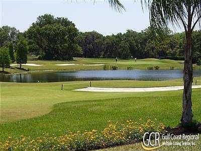 back view of golf course and lake