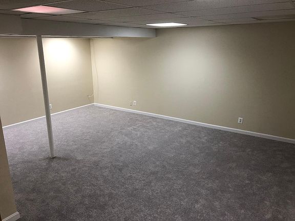 Recently painted and new carpet in lower level recreation room