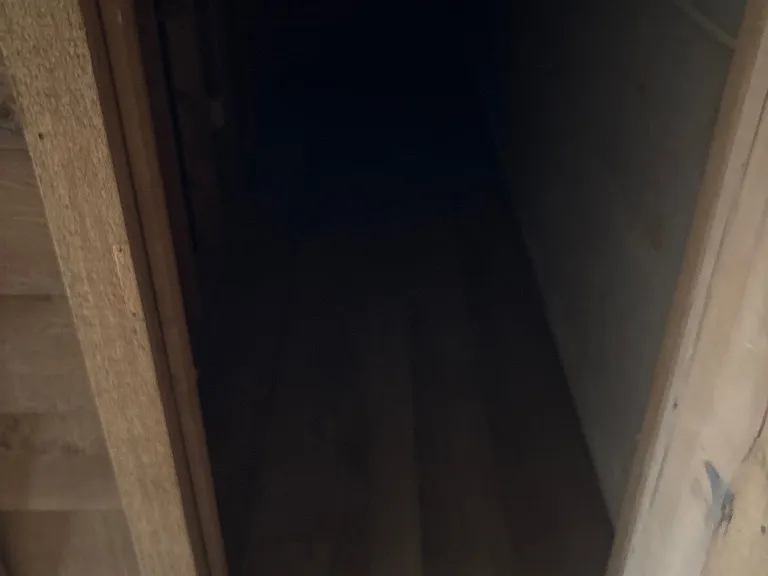 Under the basement stairs is a storage space.