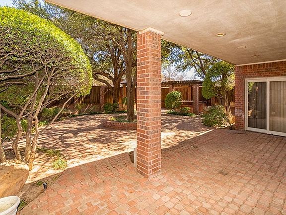 Covered patio provides plenty of room for outdoor furniture