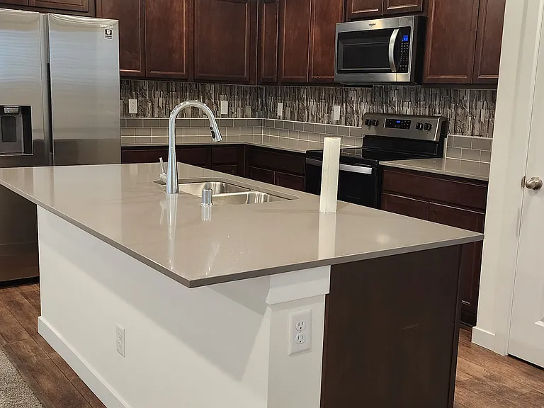 Kitchen and granite island counter top.