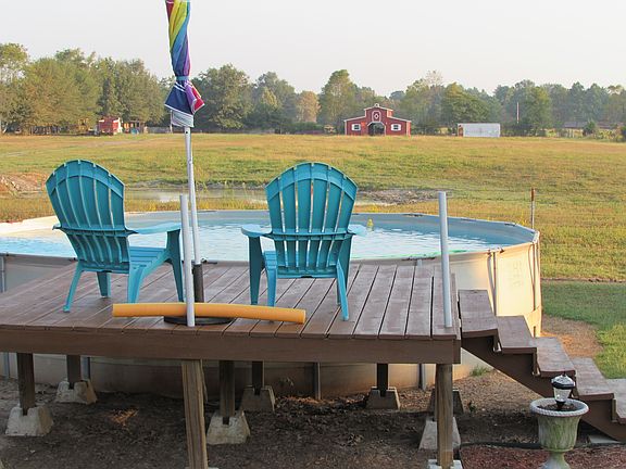 relax in pool with barn view