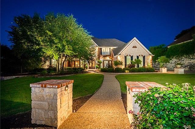 Dramatic Deep Walk Way to Home with Extensive Landscaping and Lighting. This home has many custom ch