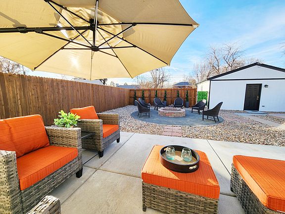 back patio area overlooking the garage, entry gate and fire pit