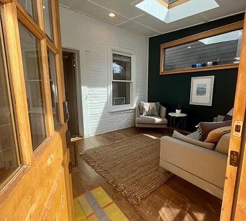 The front sun room has been used as an office and sitting room. The sunlight is beautiful all year round.