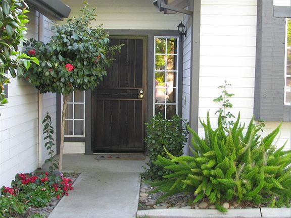 Lovely entry with professional landscaping