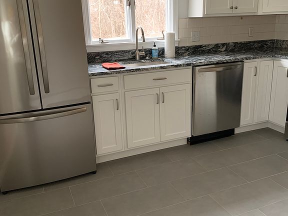 Kitchen with updated cabinetry and stainless steel appliances