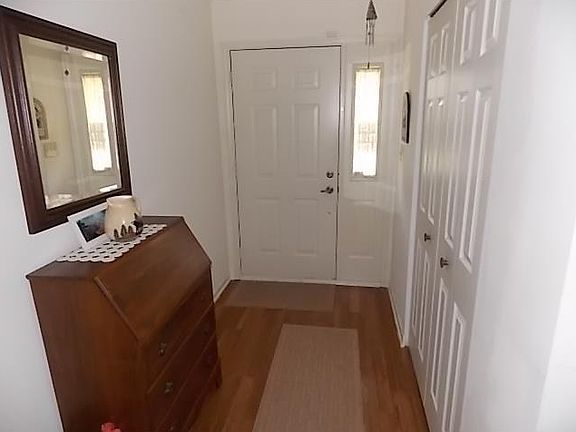 Entry. Laminate entry with double guest closet.