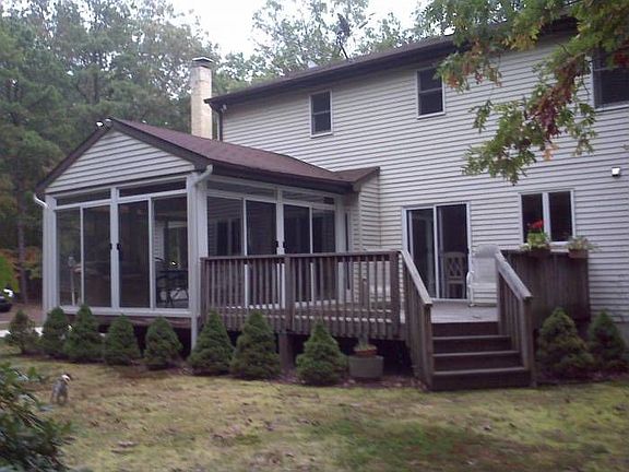 Back of house with deck
