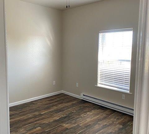 Master bedroom, with fan and air conditioner.