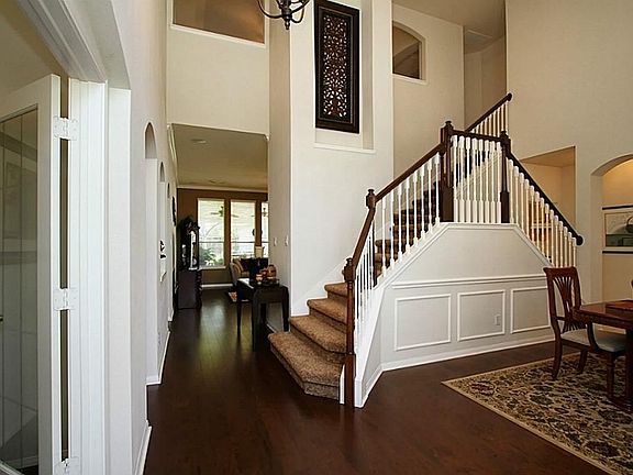 Soaring two story entry and dining room.