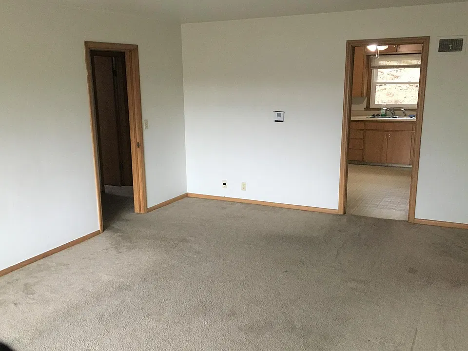 Living and family room. Kitchen entry door.