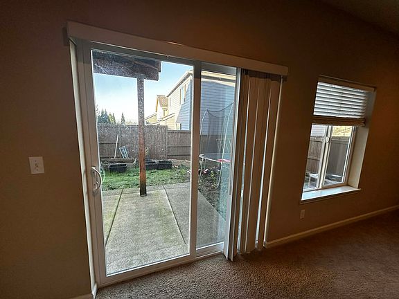 Living room with Backyard view and access door (photo 3)