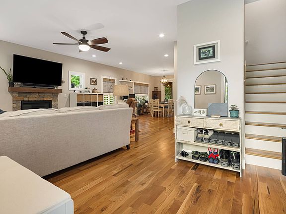 Entryway from the front door looking at the staircase upstairs to top floor and open living space on main.