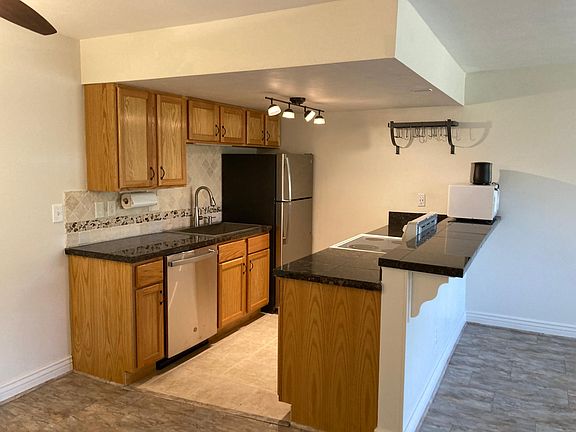 Kitchen with new stainless steel appliances.