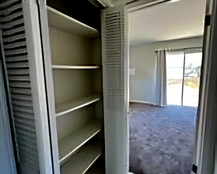 Walkway/storage closet heading into second upstairs bedroom (across from shared full bathroom)