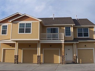 Back of condo. 2nd garage from the left is the garage for unit 110