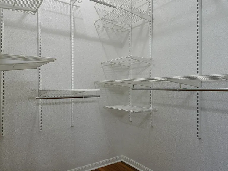 Two large walk-in closets with adjustable Elfa shelving.