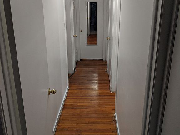 Hallway. There is a large attic space that runs the length of the house for storage
