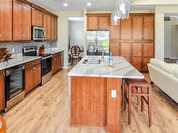 Spacious kitchen with Cambria Brittanica Quartz countertops.