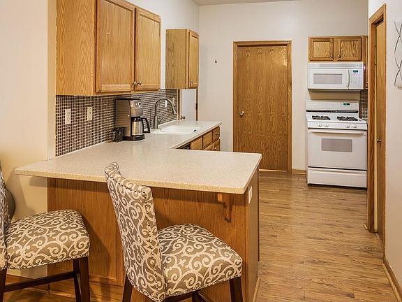 Kitchen has Corian counters with integrated sink and tile backsplash.  This is a clean and well maintained unit that is very attractive.