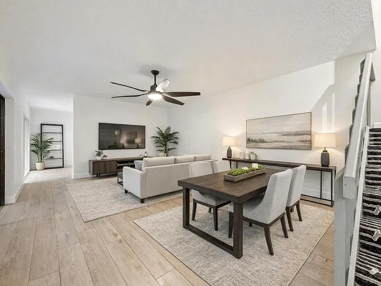 Staged living room to help visualize set up. comes unfurnished
