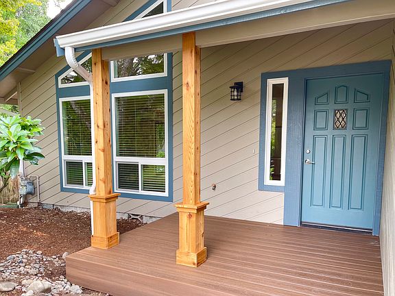 Sweet front porch is waiting for your rocking chair and holiday decorations.