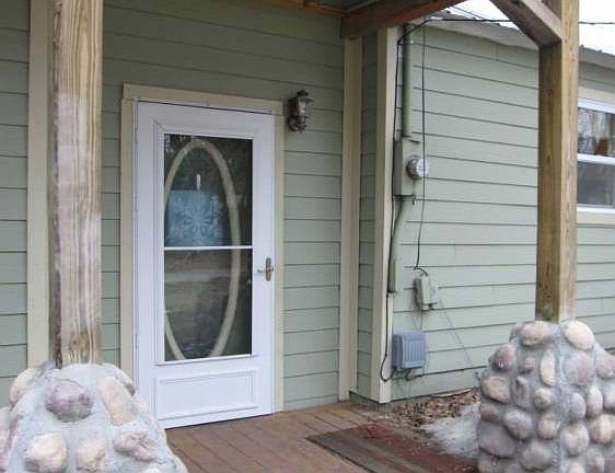 Rustic finishes bring the natural setting right to the front porches.