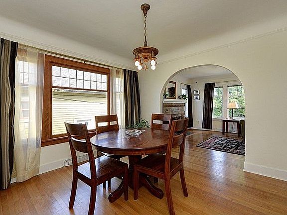 Dining room with coved ceilings, period lighting, arched doorways and great western light and exposure.