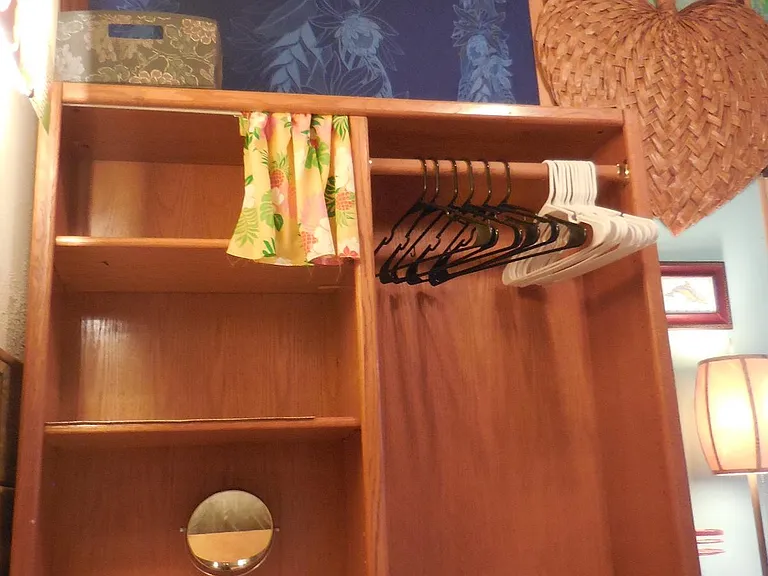 Wood open Closet Wardrobe, Hamper, and hangers provided.