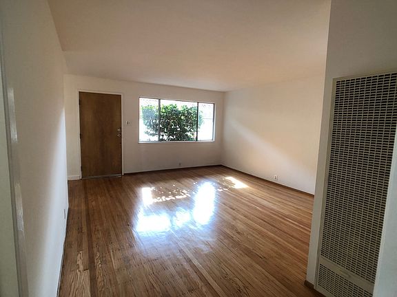 View of living room from bedroom door in back