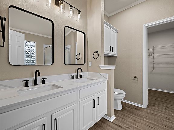 Remodeled Master bathroom with new quartz countertops, mirrors, LVP flooring - and shower & garden tub!