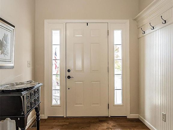 A view of the first portion of the Entry from within.  Notice the bead board treatment with hook and display rail that add to th