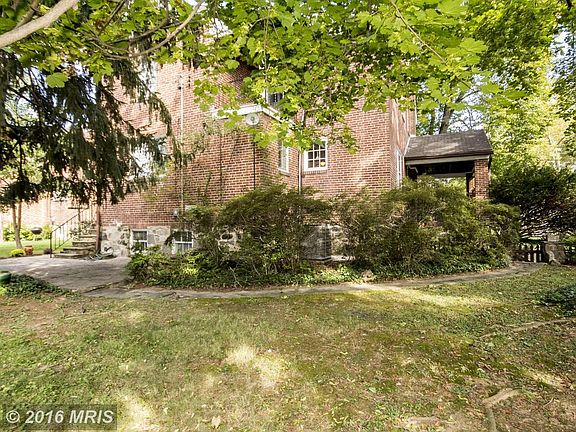 Rear of house showing Patio, Porches, large yard.