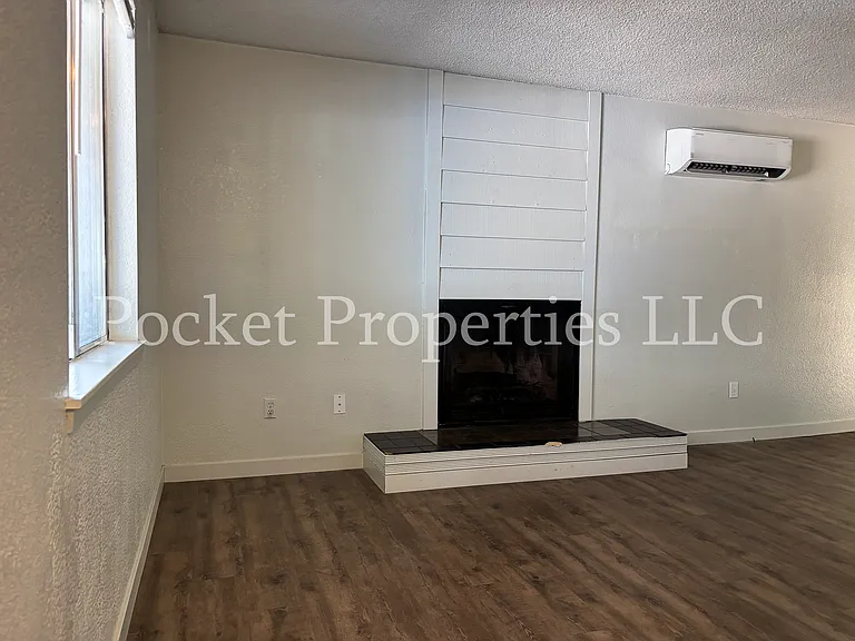 Living room with wood burning fireplace
