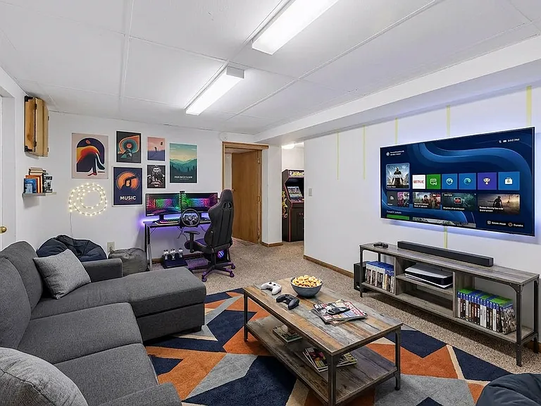 Lower level den, would be great as a kids hang out space. (AI staged)